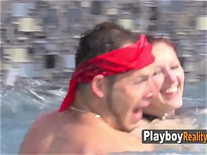 Couples play around at poolside as they get steamy and ready to party